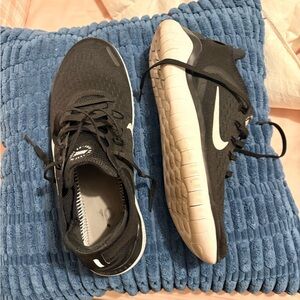 Nike Women’s Black and White walking shoes.